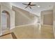Spacious living room features painted concrete floors and an open floor plan, creating a modern and inviting atmosphere at 5273 Sunset Canyon Dr, Kissimmee, FL 34758