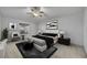 This spacious main bedroom features modern decor, a ceiling fan, and natural light at 5273 Sunset Canyon Dr, Kissimmee, FL 34758