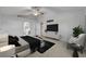 Spacious main bedroom featuring modern decor, a ceiling fan, and an ensuite bathroom at 5273 Sunset Canyon Dr, Kissimmee, FL 34758