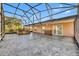 Spacious screened-in patio and outdoor area with hot tub at 5273 Sunset Canyon Dr, Kissimmee, FL 34758