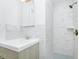 Bathroom featuring a shower with tile surround and a vanity sink at 5513 Riordan Way, Orlando, FL 32808