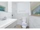 Bathroom featuring a toilet, vanity sink, and tile backsplash at 5513 Riordan Way, Orlando, FL 32808