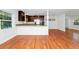 Bright, open kitchen featuring stainless steel appliances and hardwood floors at 5513 Riordan Way, Orlando, FL 32808