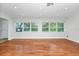 Bright living room with hardwood floors, recessed lighting, and large windows for plenty of natural light at 5513 Riordan Way, Orlando, FL 32808