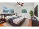 Bedroom featuring a bed, nightstands, and a flat screen television at 5513 Riordan Way, Orlando, FL 32808