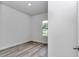 View of an empty bedroom featuring wood-look flooring and a window with a view at 586 Marion Oaks Trl, Ocala, FL 34473