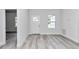 Bright entryway featuring light wood flooring, a window, and a white front door at 586 Marion Oaks Trl, Ocala, FL 34473