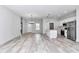 Open-concept living space with modern light fixtures, light-colored floors, and white walls at 586 Marion Oaks Trl, Ocala, FL 34473
