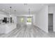 Spacious living room with lots of natural light, open layout, and sliding glass doors at 586 Marion Oaks Trl, Ocala, FL 34473