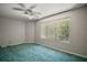 Bedroom featuring a large window and neutral paint at 612 Heron Bay Dr, Orlando, FL 32825