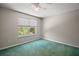 Bedroom featuring a window providing natural light and a ceiling fan at 612 Heron Bay Dr, Orlando, FL 32825
