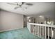 Bonus room with staircase to the first floor and plenty of space for lounging at 612 Heron Bay Dr, Orlando, FL 32825
