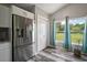 Well-lit kitchen featuring stainless steel appliances, ample cabinet space, and a view to the backyard at 612 Heron Bay Dr, Orlando, FL 32825