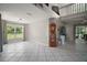 Open-concept living room with tile flooring, large windows, and high ceilings at 612 Heron Bay Dr, Orlando, FL 32825