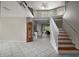 Spacious living room featuring high ceilings, tile flooring, and a staircase leading to the upper level at 612 Heron Bay Dr, Orlando, FL 32825