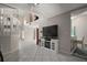 Open-concept living area with high ceilings, tile floors, a breakfast bar, and natural light at 612 Heron Bay Dr, Orlando, FL 32825