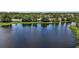 Scenic view of a peaceful pond surrounded by lush greenery, offering a serene natural setting at 612 Heron Bay Dr, Orlando, FL 32825