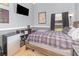 Bedroom featuring a mini-fridge, TV, and decor, designed for relaxation and entertainment at 637 Blenheim Loop, Winter Springs, FL 32708