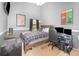 Comfortable bedroom featuring a large window, ceiling fan, and gaming setup at 637 Blenheim Loop, Winter Springs, FL 32708