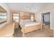 Cozy main bedroom with carpet flooring, ceiling fan, and connected bathroom at 637 Blenheim Loop, Winter Springs, FL 32708