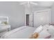 Inviting bedroom featuring light blue walls and ample natural light from the window at 637 Blenheim Loop, Winter Springs, FL 32708