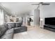 Spacious open-concept living room with tile flooring, adjoining kitchen and living spaces at 637 Blenheim Loop, Winter Springs, FL 32708