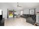 Comfortable living room features a tile floor and an easy access to the backyard at 637 Blenheim Loop, Winter Springs, FL 32708