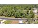 Wide aerial view of the street and trees surrounding the home at 6691 Sw 151Sr Loop, Ocala, FL 34473