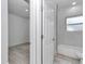 The bathroom features tiled walls, a soaking tub, and white fixtures at 6691 Sw 151Sr Loop, Ocala, FL 34473