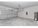 Spacious two car garage with concrete block wall with open garage door at 6691 Sw 151Sr Loop, Ocala, FL 34473