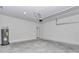 Spacious two car garage with concrete block wall and water heater installed at 6691 Sw 151Sr Loop, Ocala, FL 34473