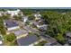 Aerial shot showing the neighborhood with mature trees and diverse housing styles at 674 Douglas Ave, Winter Park, FL 32789