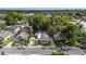 Aerial view of a home, showing its location, roof, and surrounding neighborhood with mature trees at 674 Douglas Ave, Winter Park, FL 32789