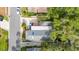 An aerial view shows this home's location, layout, deck, and mature trees at 674 Douglas Ave, Winter Park, FL 32789