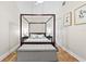 Spacious bedroom features a four-poster bed, neutral color palette, and comfortable bench seating at 674 Douglas Ave, Winter Park, FL 32789