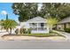 Charming home with a welcoming front porch, manicured landscaping, and classic curb appeal at 674 Douglas Ave, Winter Park, FL 32789