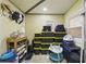Organized storage room with shelves, bins, and a variety of containers for efficient space utilization at 674 Douglas Ave, Winter Park, FL 32789