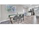 View of the dining area with table, chairs and a window overlooking the yard at 7033 Budapest Way, Orlando, FL 32822