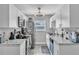 Modern kitchen with stainless steel appliances and white cabinets, offering ample counter space at 7033 Budapest Way, Orlando, FL 32822