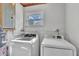 Clean laundry room with modern Samsung washer and dryer units at 7033 Budapest Way, Orlando, FL 32822