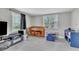 View of the living area with lots of space and two large windows at 7033 Budapest Way, Orlando, FL 32822