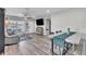 Open-concept living and dining area with wood-look floors and neutral tones at 7033 Budapest Way, Orlando, FL 32822