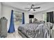 The main bedroom features a ceiling fan and large windows at 7033 Budapest Way, Orlando, FL 32822