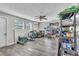 Bright storage room with vinyl floors, large windows and ceiling fan at 7033 Budapest Way, Orlando, FL 32822
