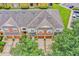 Aerial view of townhome showcasing roof, garages, and landscaping at 707 N Marotta Loop, Ocoee, FL 34761