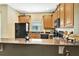 Well-equipped kitchen featuring modern appliances, ample counter space, and stylish cabinetry at 707 N Marotta Loop, Ocoee, FL 34761