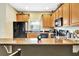 Inviting kitchen with black appliances, and a breakfast bar at 707 N Marotta Loop, Ocoee, FL 34761