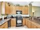 This kitchen boasts attractive countertops and wooden cabinetry at 707 N Marotta Loop, Ocoee, FL 34761