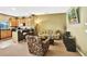 Comfortable living area featuring a cozy sofa and decorative accents, open to the kitchen at 707 N Marotta Loop, Ocoee, FL 34761