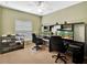 Functional office space features dual workstations, ample storage, and a ceiling fan for comfort at 707 N Marotta Loop, Ocoee, FL 34761